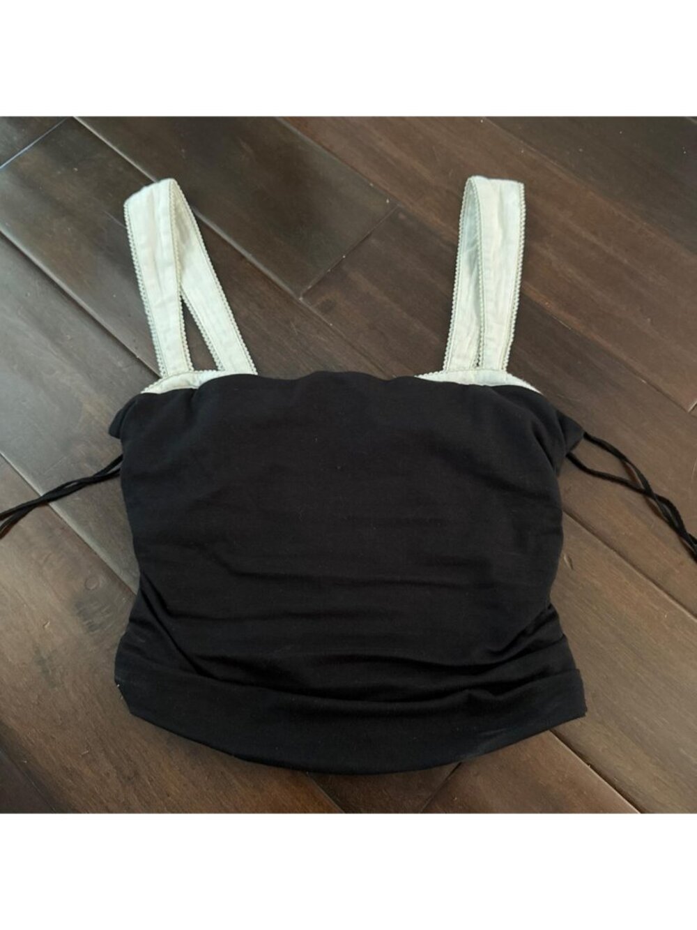Black Free Peoplecrop top with white straps and ruching on the sides